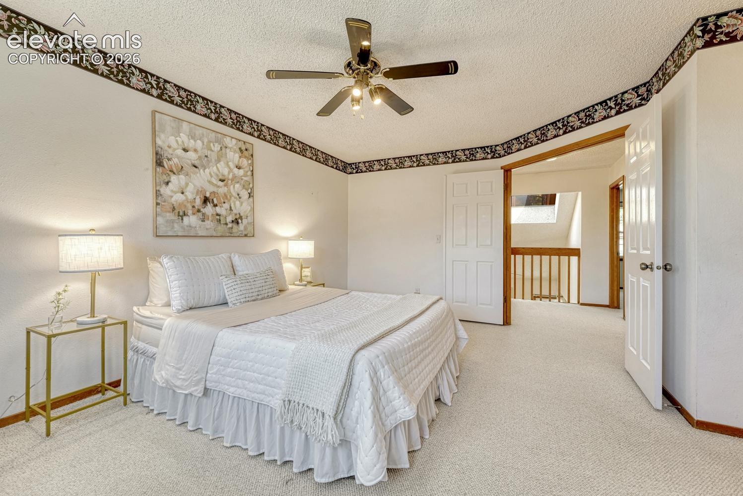 Upper level primary bedroom.