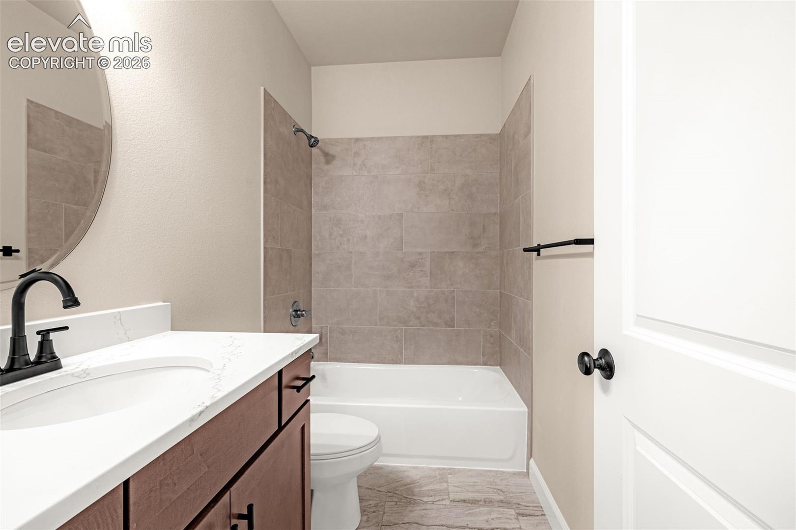 Steps away from the Office is a remolded full bathroom.  