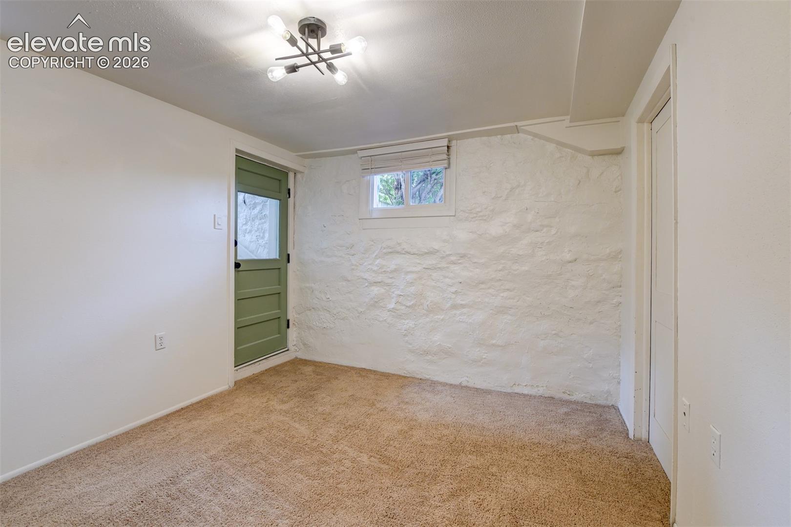 Basement unit located in the back of the property 