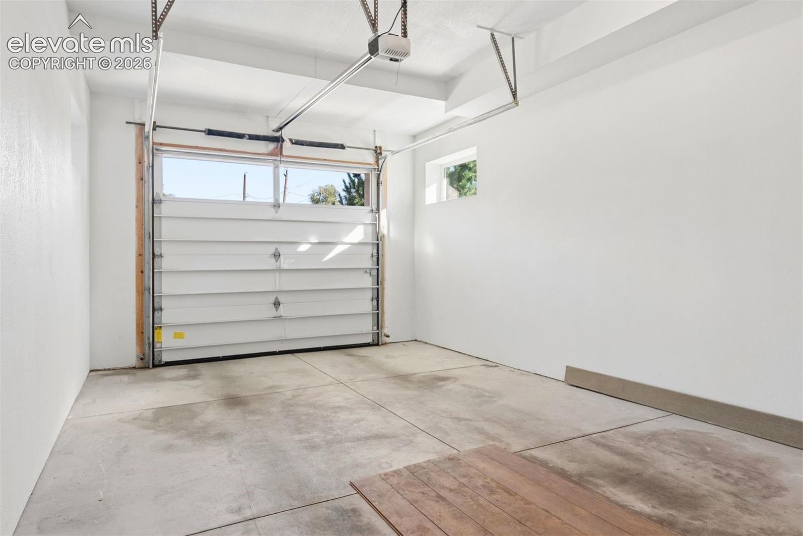 Front one-car garage (2 one-cars at property) with 9' entry door