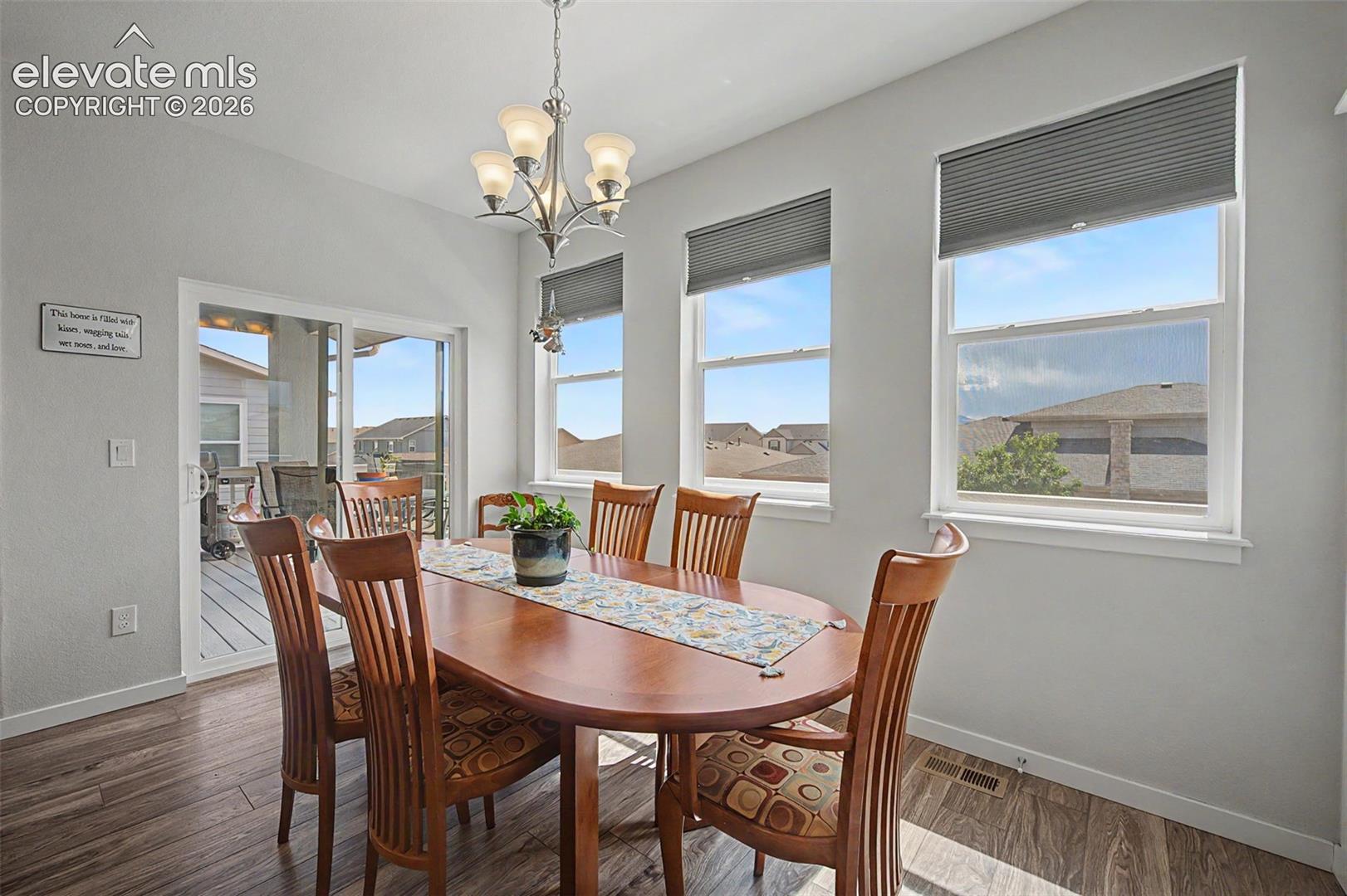 The bright dining area is perfect for daily meals and entertaining. This room provides access to the fantastic deck.