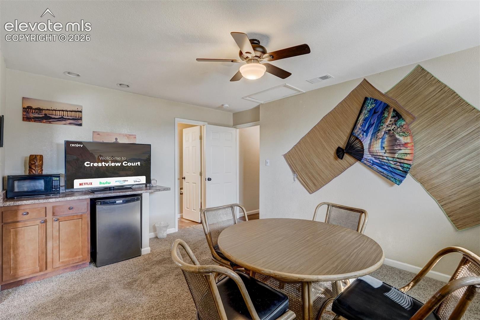 Built-in cabinetry with a countertop, recessed lighting, and a ceiling fan