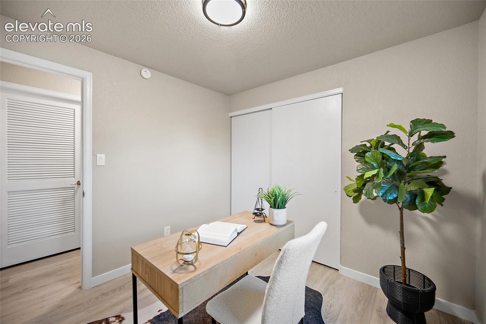 Light wood-finish flooring with neutral wall paint