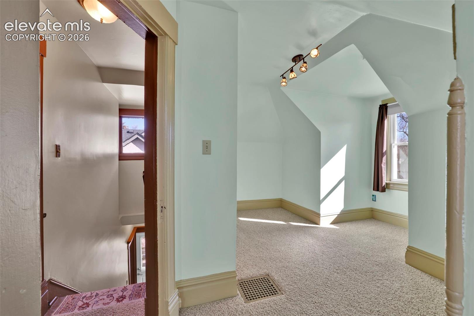 stairs and secondary upstairs bedroom
