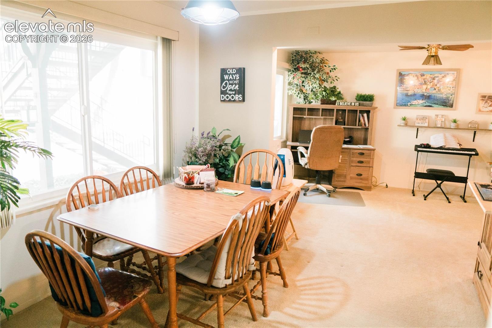 Bright interior with large windows and a built-in office nook