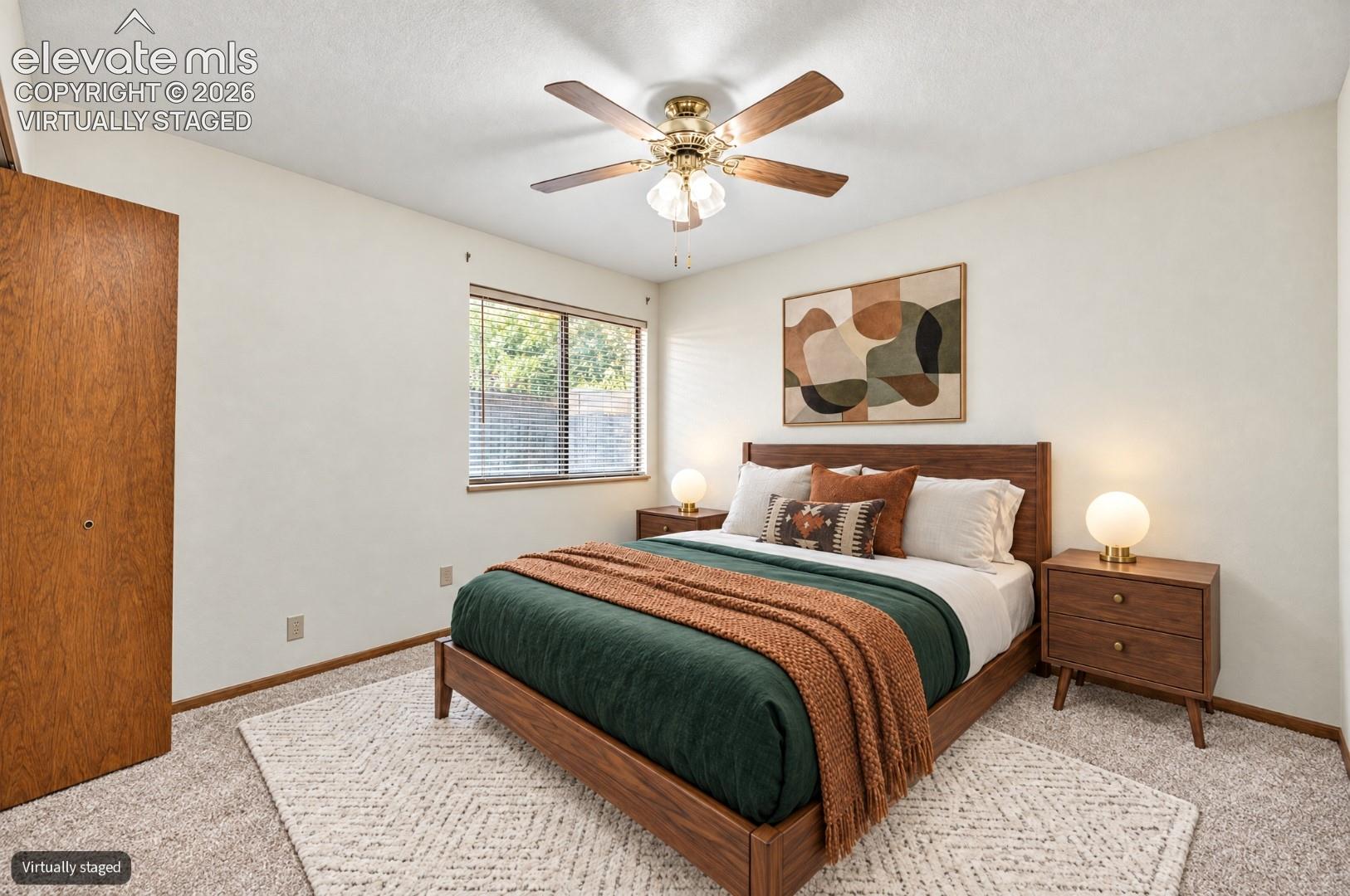Virtually Staged Warm room featuring a window with horizontal blinds, a wood-finish ceiling fan, and carpet flooring