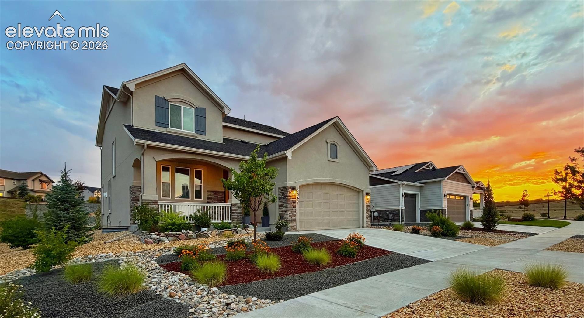 Pikes Peak views from the front porch, a south-facing driveway, and upgrades on every level. This 2021 Flying Horse contemporary was finished with a 'forever home' vision. It offers 4 bedrooms, 3.5 baths, a loft, and a dedicated main-floor office, with 9-ft ceilings throughout. The custom kitchen is the heart of the home, showcasing breathtaking Taj Mahal quartzite countertops, custom cabinetry, and a built-in coffee bar. It opens to a sunlit living room with a cozy fireplace. Upstairs are three bedrooms, including the primary suite with a double-sink vanity. A spacious loft adds flex space, with a convenient laundry room nearby. Downstairs, the spa-like basement is a true retreat. Work out in the home gym, with space for an infrared sauna, or unwind in the spacious family room with a dry bar and beverage cooler. The custom bath features a marble shower floor. Every detail has been considered. Updated electrical brings recessed lighting, dimmers, and new fixtures to every room. Wide-plank laminate flooring covers the main level, with plush new carpet downstairs. The oversized garage includes a built-in workbench. Central AC and a whole-home humidifier keep you comfortable year-round. Out back, relax in the beautifully landscaped yard with no home directly behind. Out front, street lights line a welcoming neighborhood made for evening strolls. The home is in Academy District 20, close to Interquest shopping and dining, I-25, Powers, and the Air Force Academy. Flying Horse amenities include a clubhouse, pool, tennis, fitness center, trails, and playground. The home is offered unfurnished; sellers will consider offers to purchase it fully or partially furnished.