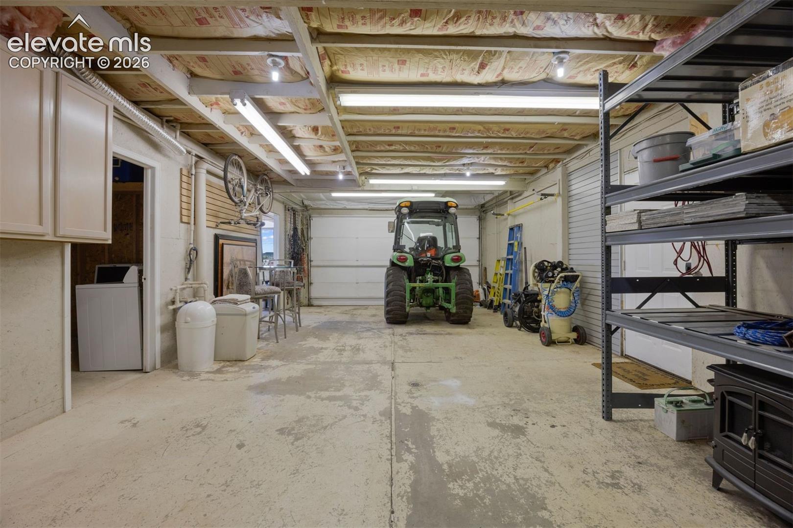 Barn interior with concrete floor and workshop space.