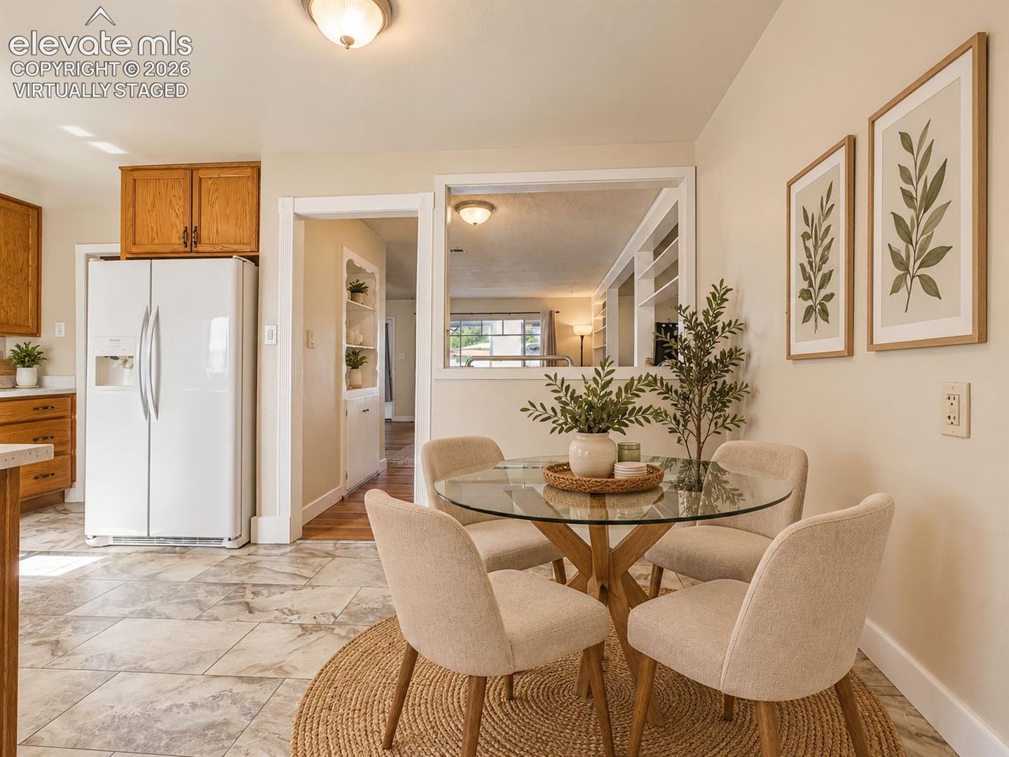 (Virtually Staged)
Inviting breakfast nook with tile-look flooring and a convenient location adjacent to the kitchen and main living area.