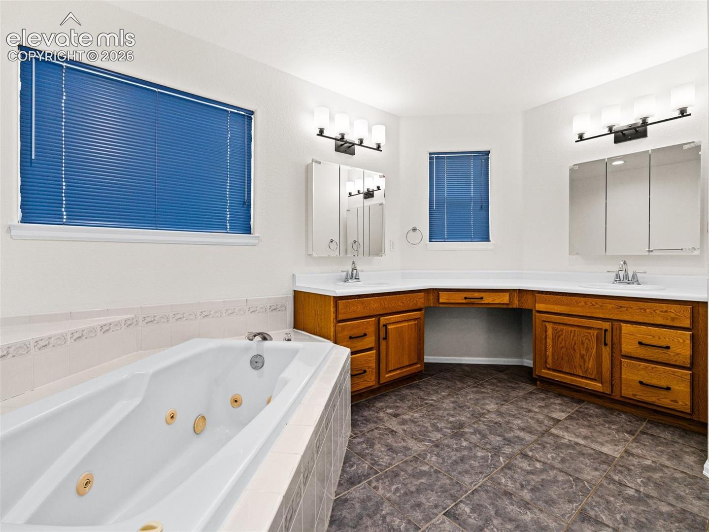 Large bath with jetted tub, walk in shower, separate toilet, new fixtures, fresh paint