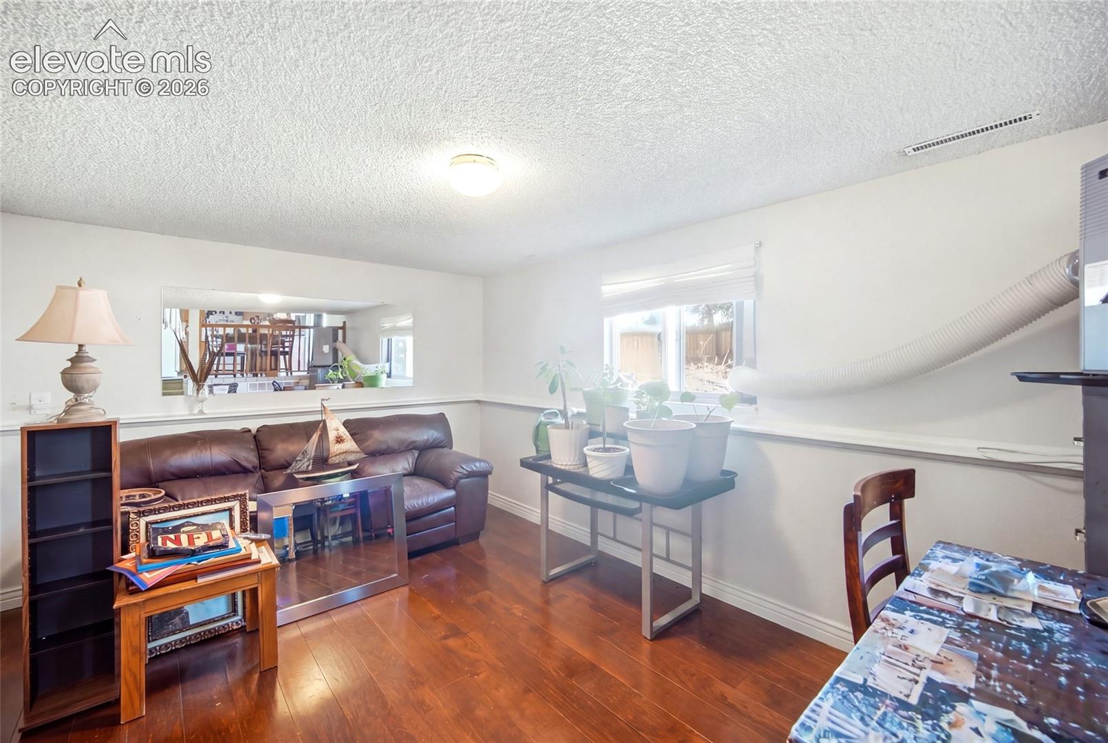 Lower level family room with wood flooring