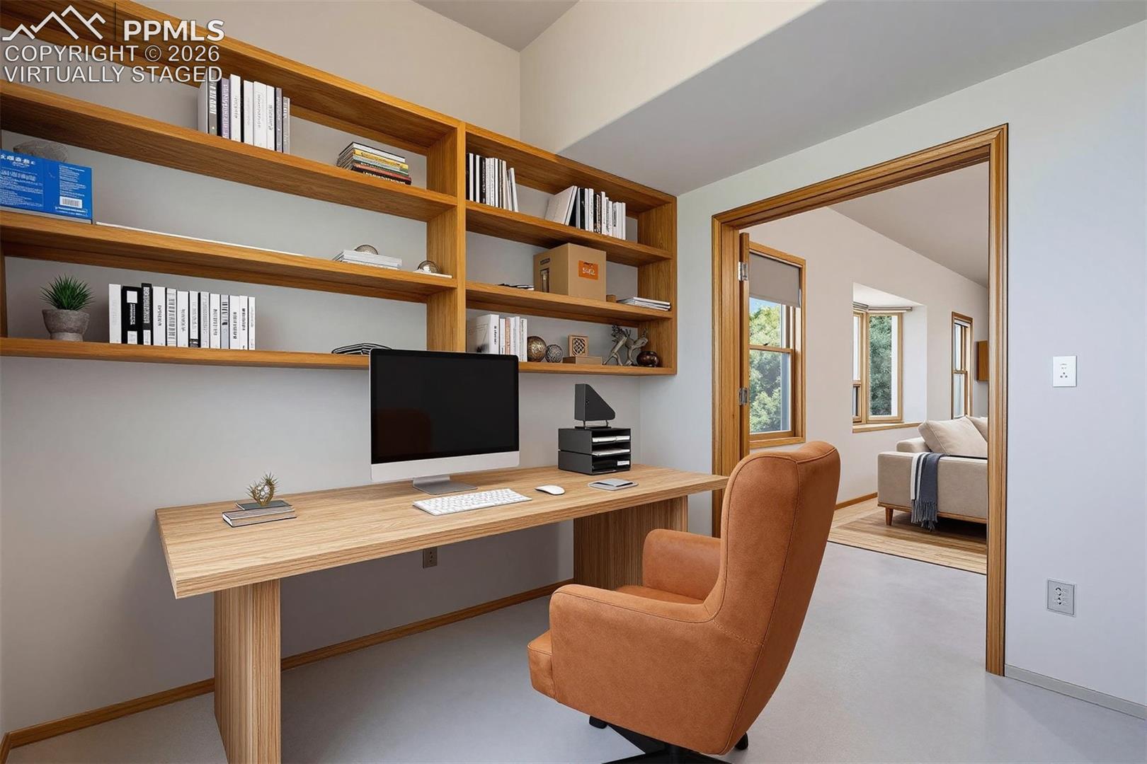 virtually staged Built-in wooden shelving and desk unit provides functional workspace
