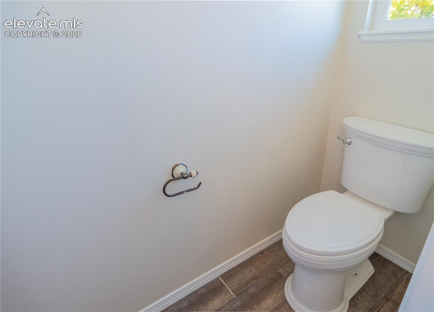 A separate toilet room provides additional privacy within the primary suite.