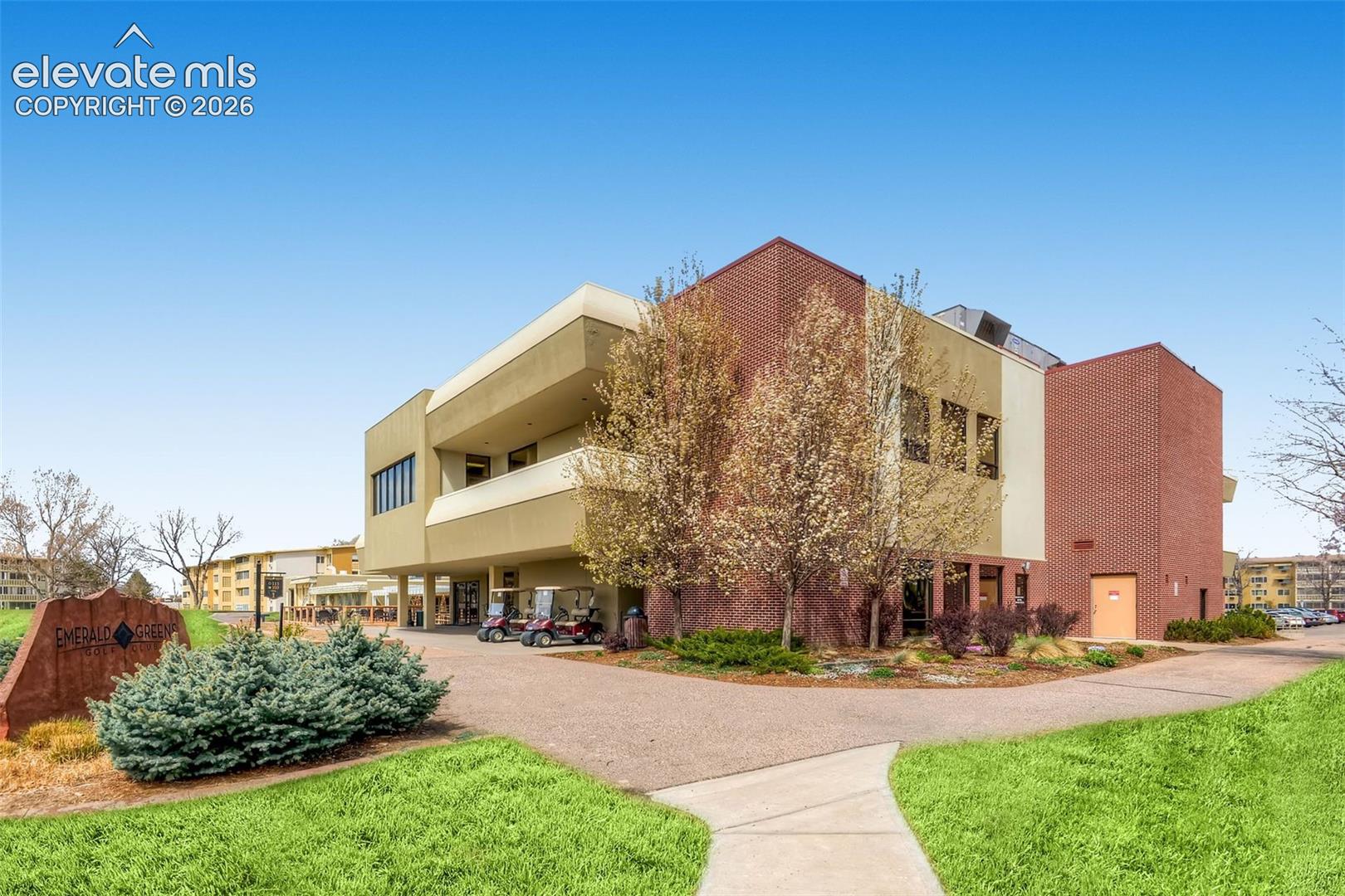Multi-story building featuring brick and stucco exterior finishes