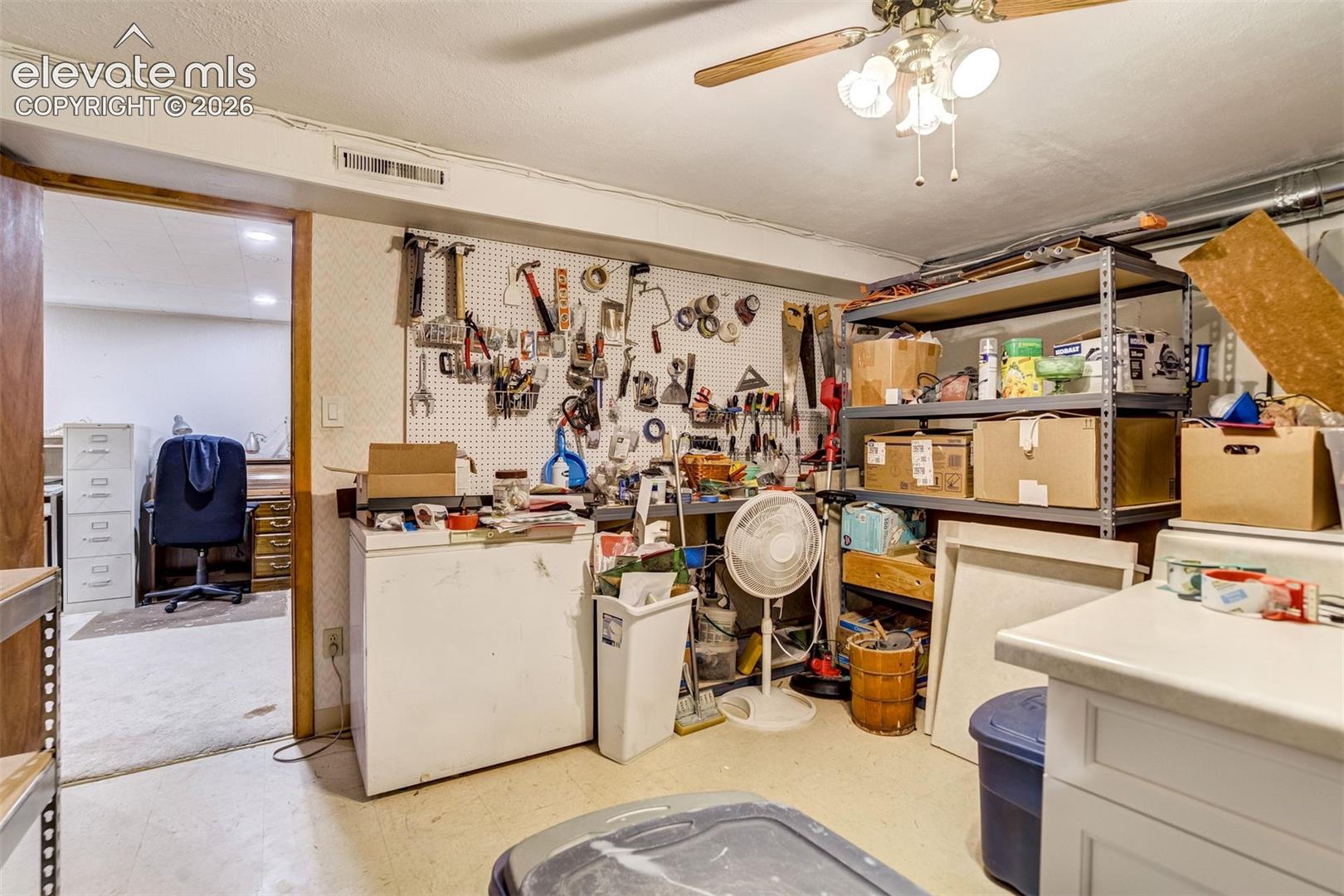 Non-conforming basement bedroom, currently used for storage/workshop.