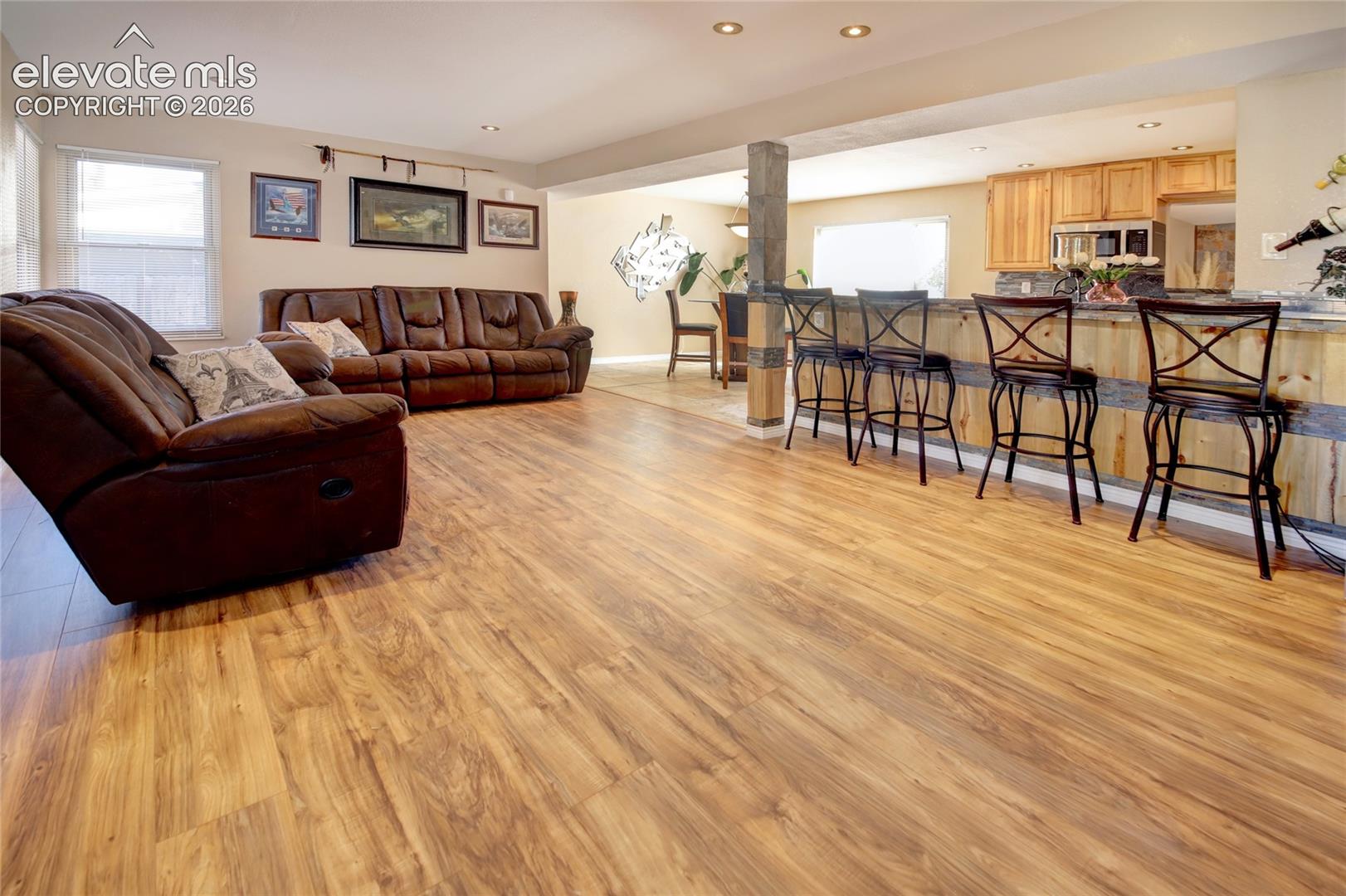 Beautiful LVP floors through out the main level, open concept from kitchen to dining to living room!