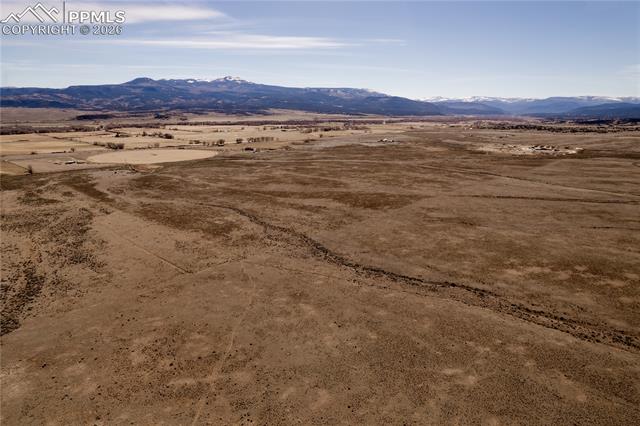 View of mountain backdrop featuring rural landscape