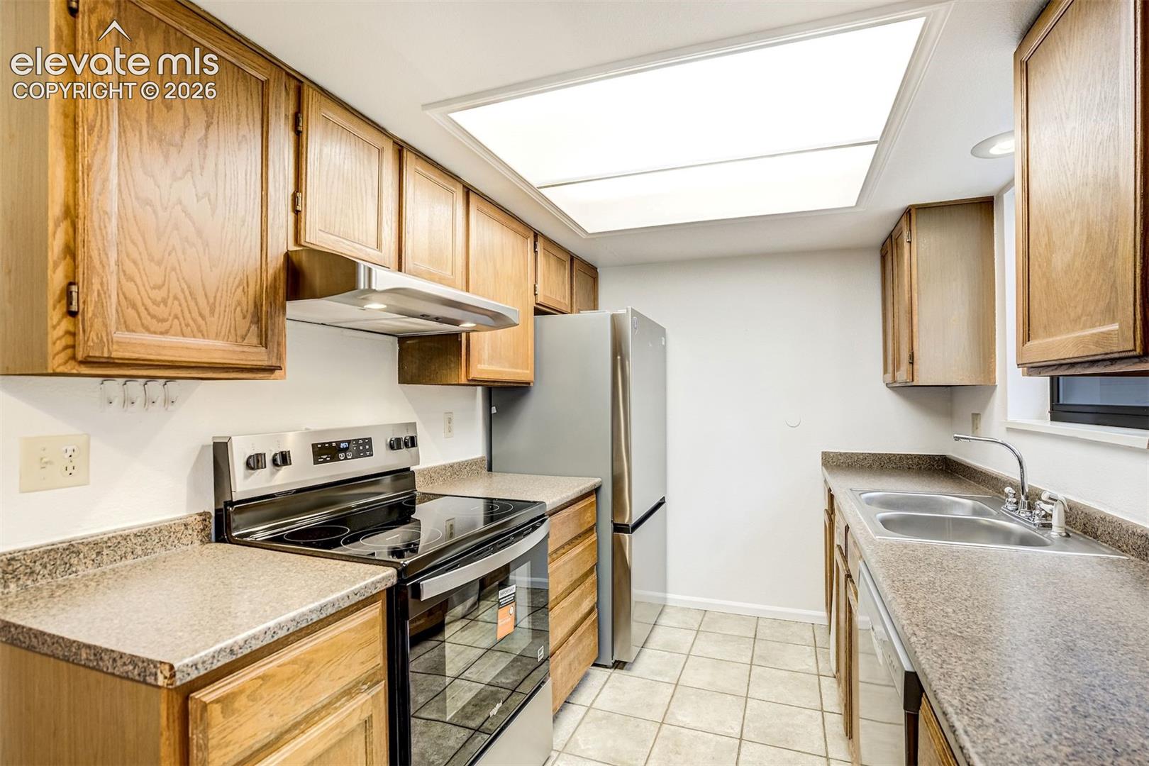 Galley kitchen with NEW Stainless-Steel Appliances 