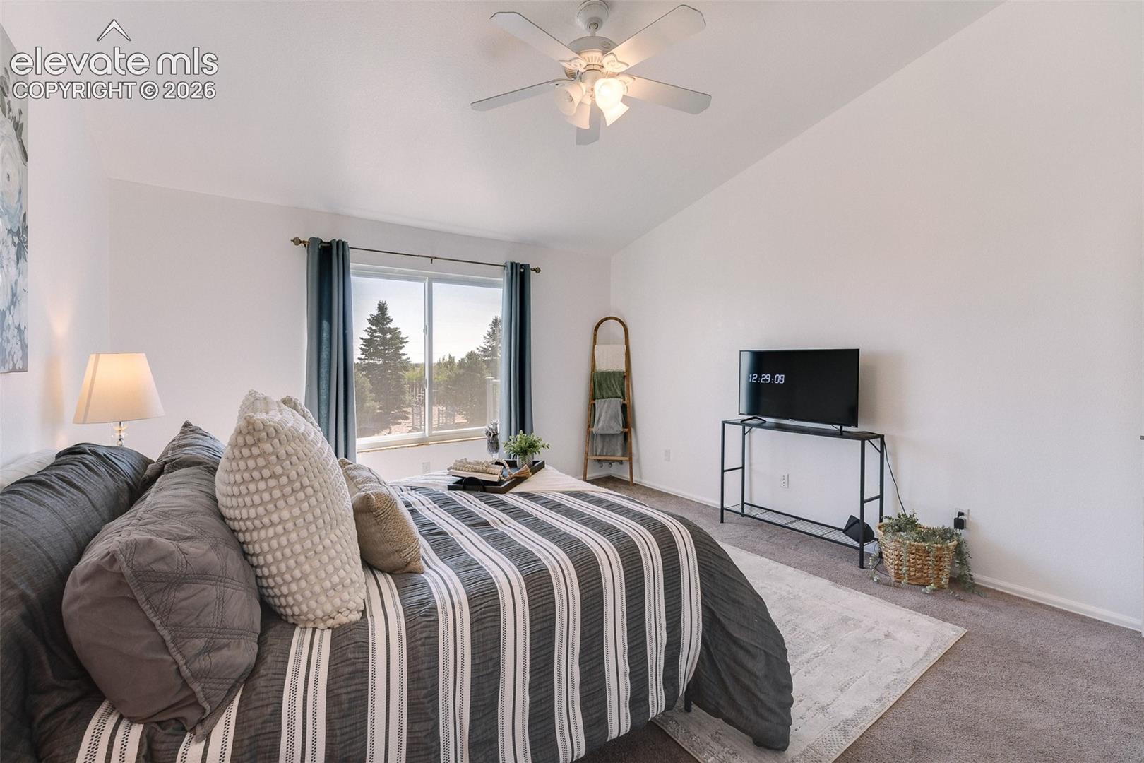 Main level vaulted Primary Bedroom. 