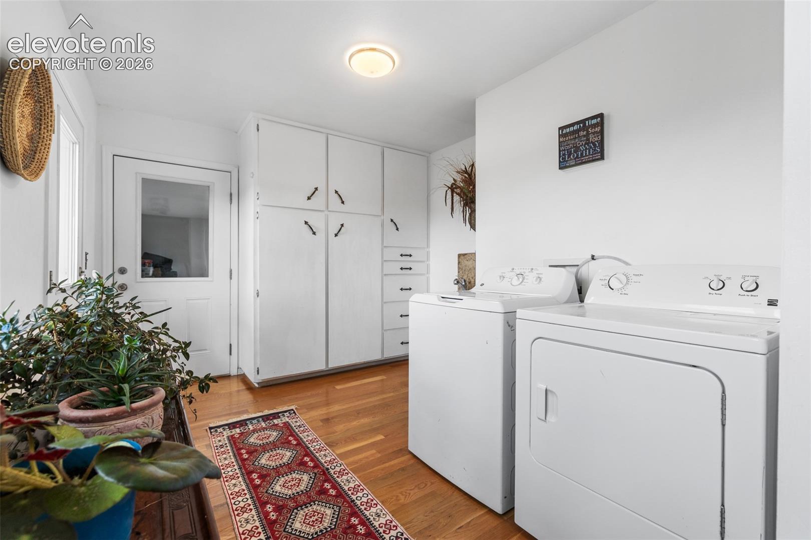 This mud room can be entered from the front of the home or the garage. Lots of storage and hard wood floors and utility sink