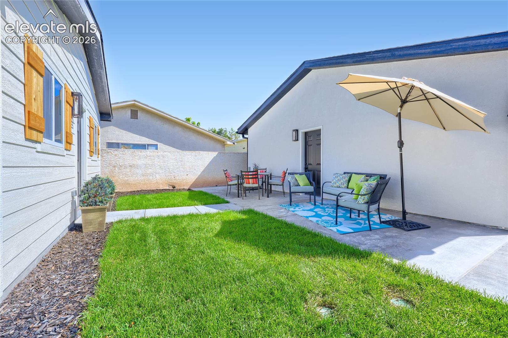 Another view of the backyard area. Note the easy access to the brand new, 2-car garage. This backyard also is completely fenced, with privacy fencing.