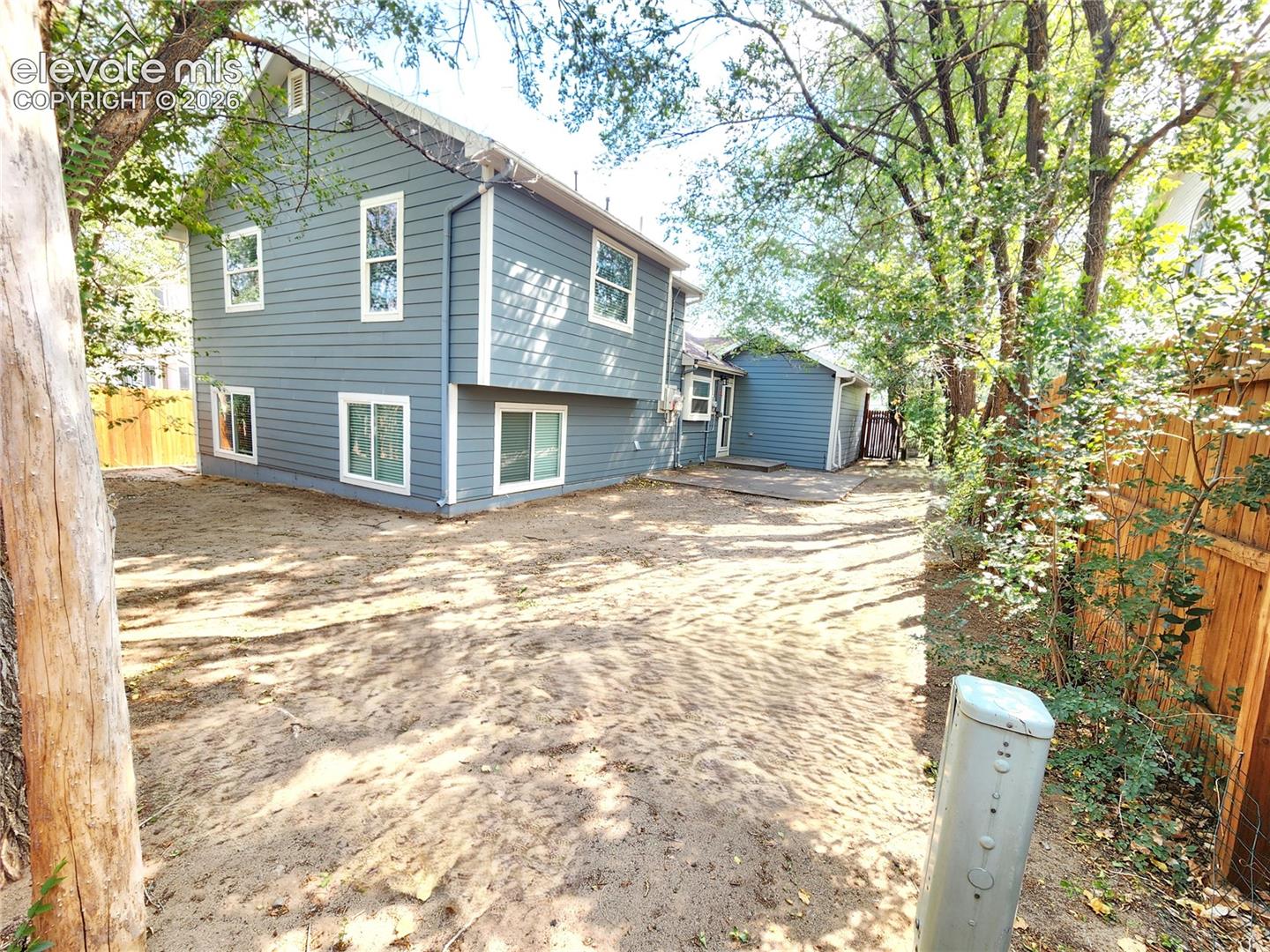 Expansive backyard space offering privacy and room to play or entertain