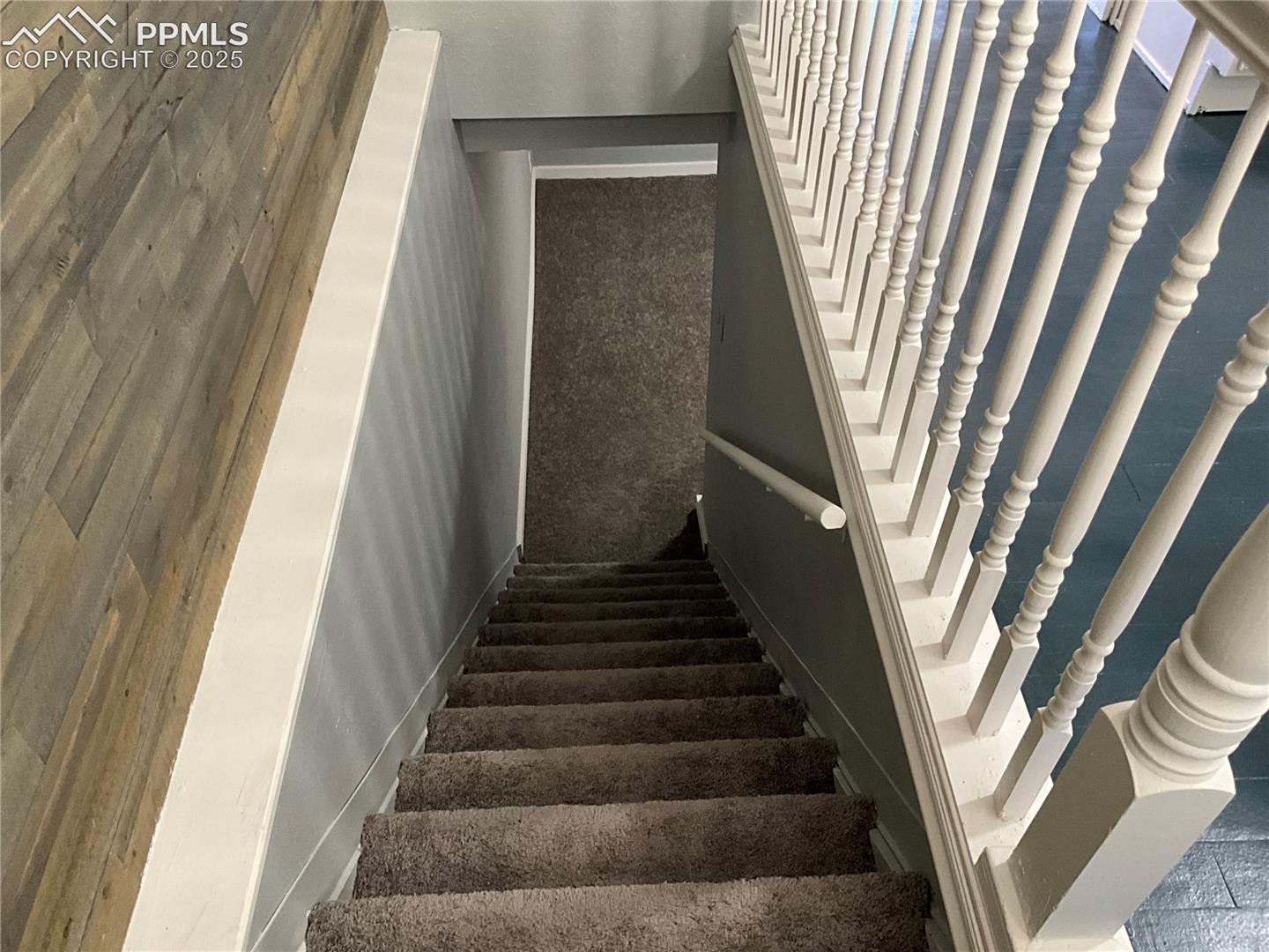 View of stairway w/ new carpeting 