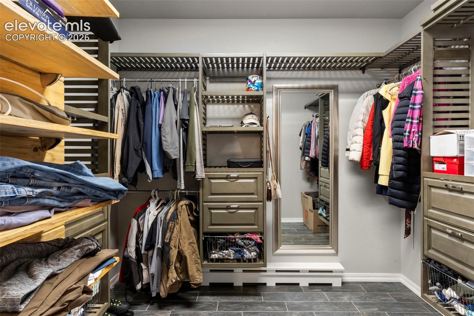 Spacious closet featuring wood finish floors