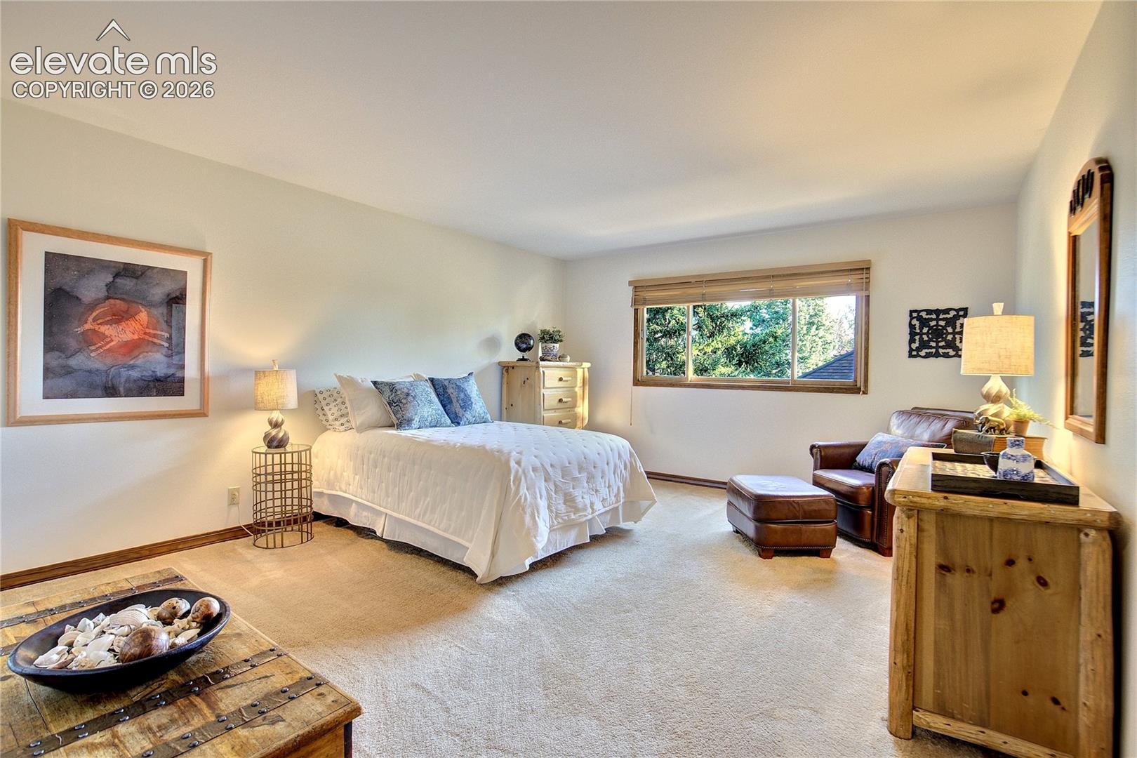 One of three upper-level bedrooms, generously proportioned for comfortable everyday living or welcoming guests.