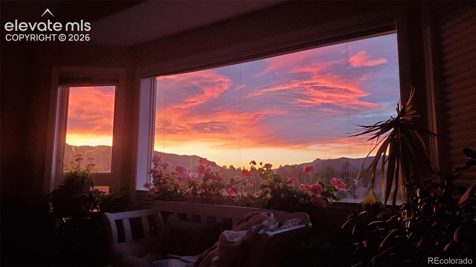 Expansive window framing a mountain backdrop