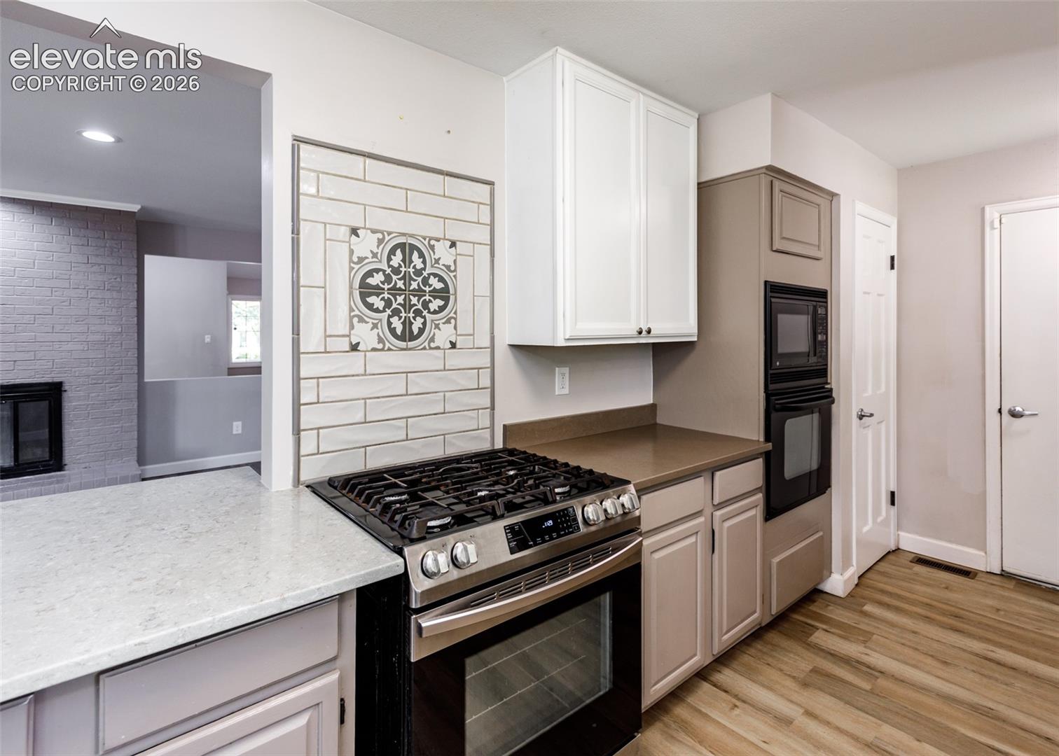 Stainless steel gas range, built-in oven, and built-in microwave