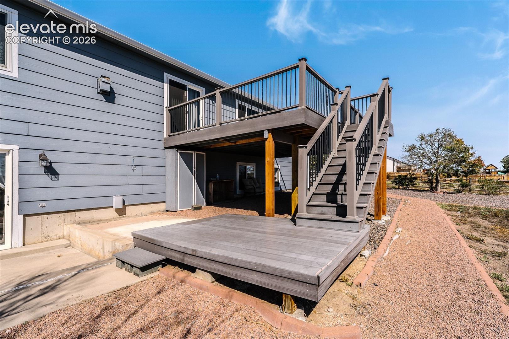 Backyard deck and lower level patio.