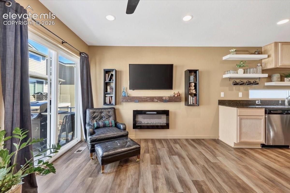 This open and spacious living area has a fireplace and walkout to the balcony. 