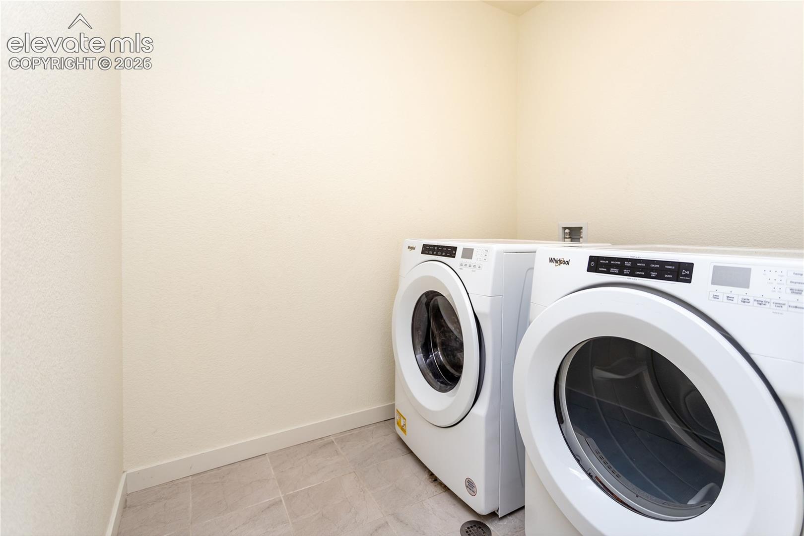 Laundry room is conveniently located on the upper level.