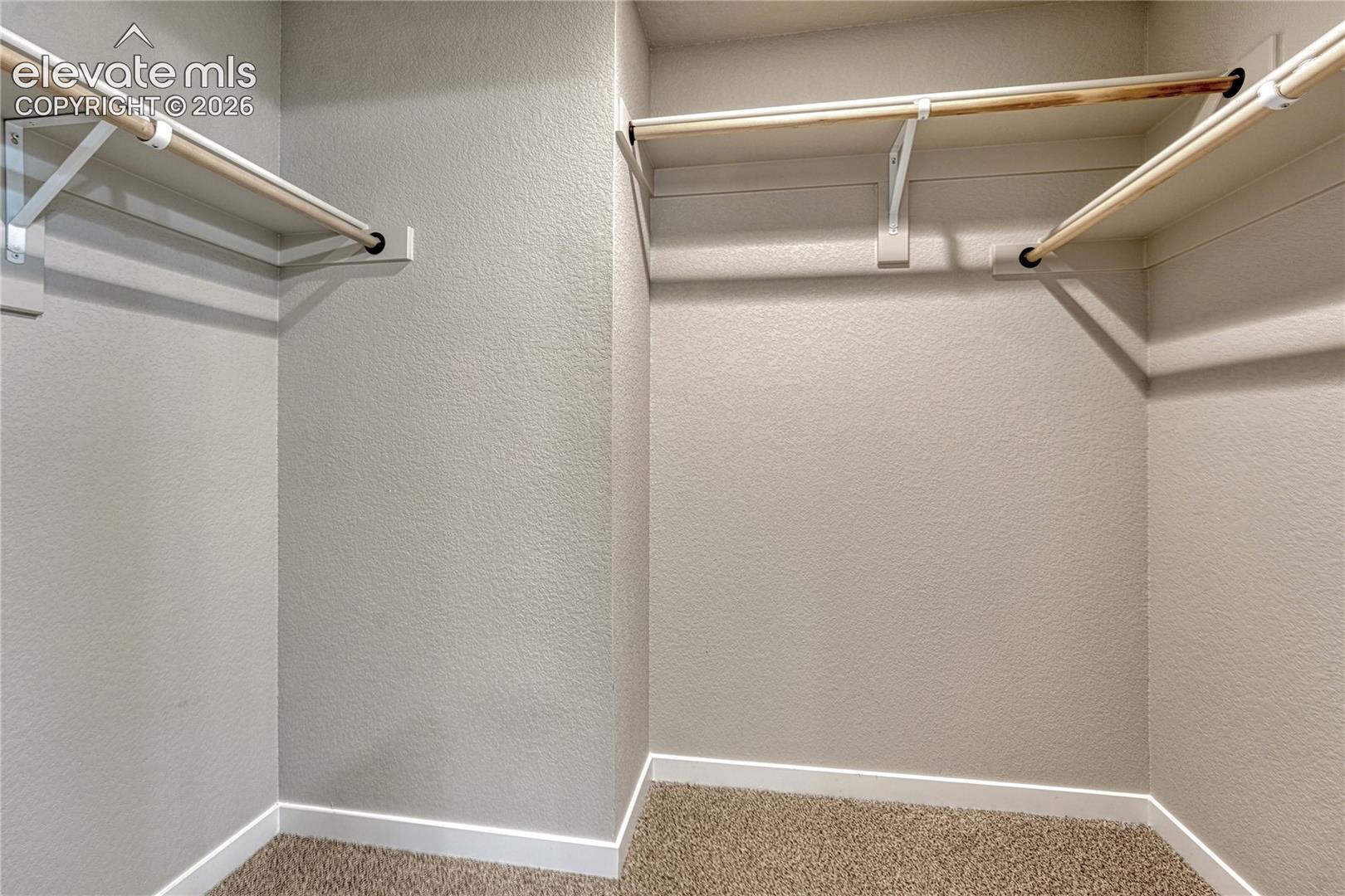 Walk-in closet in primary suite. 