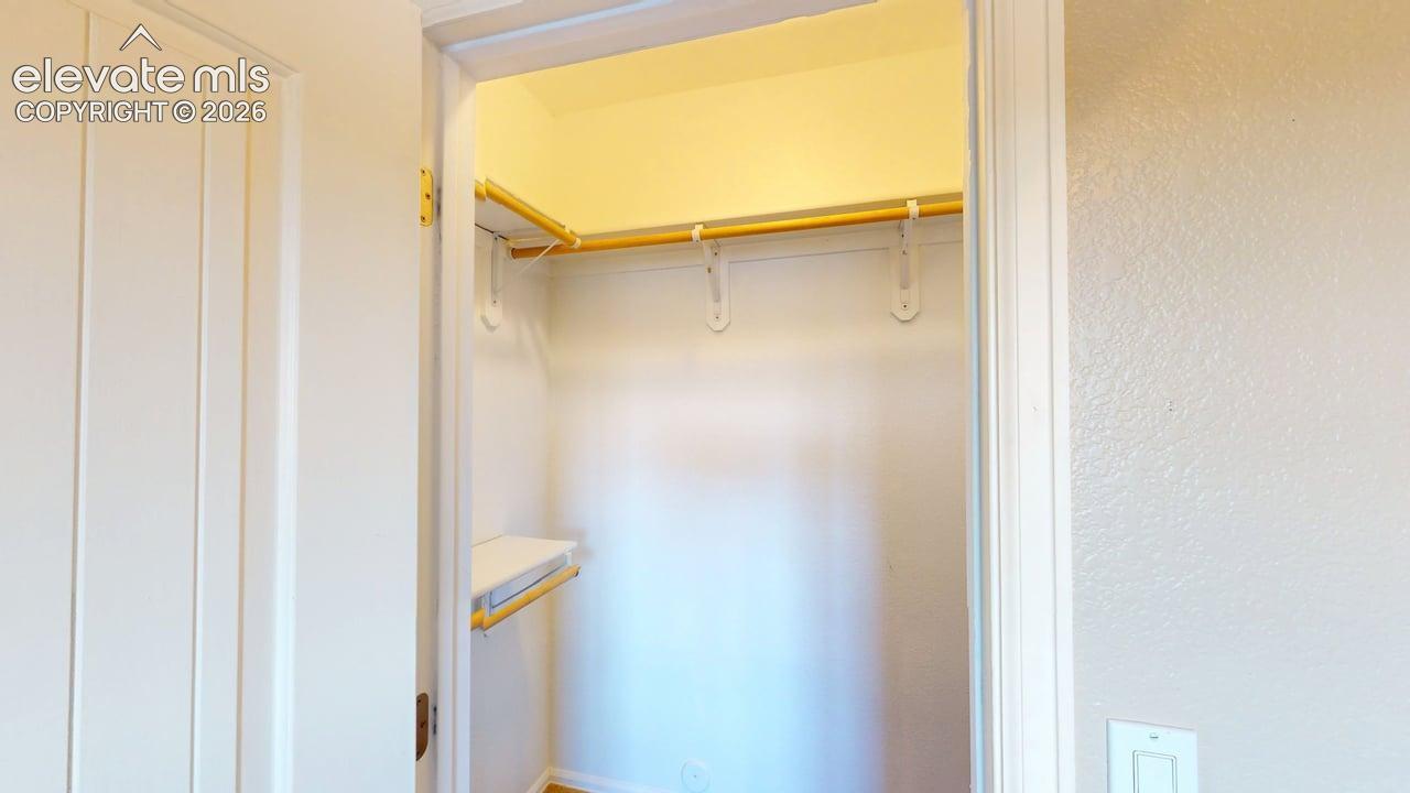 Built-in closet shelving with a hanging rod