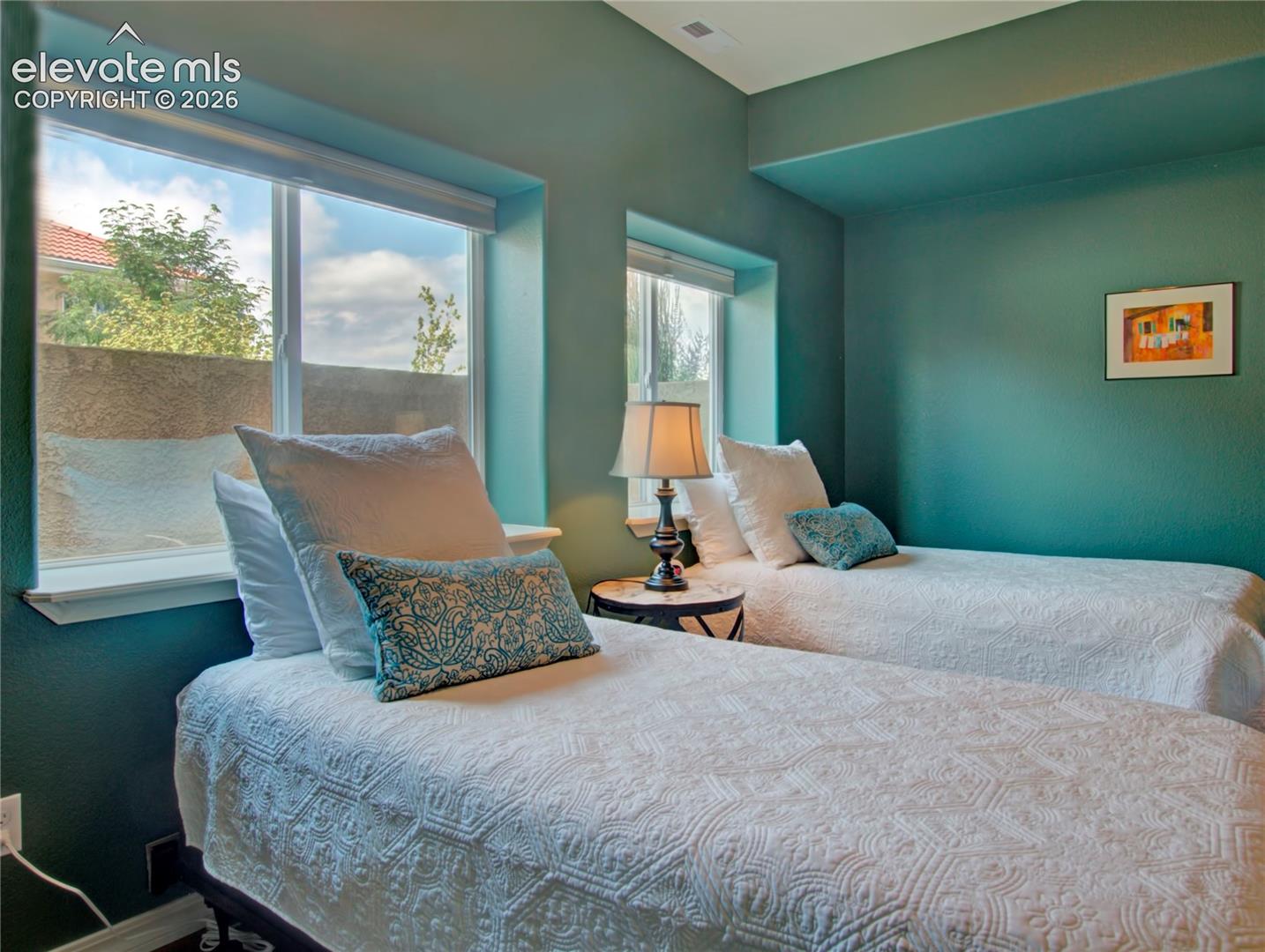 third lower Bedroom featuring multiple windows, recessed lighting, and a consistent color palette. access to full bath.
