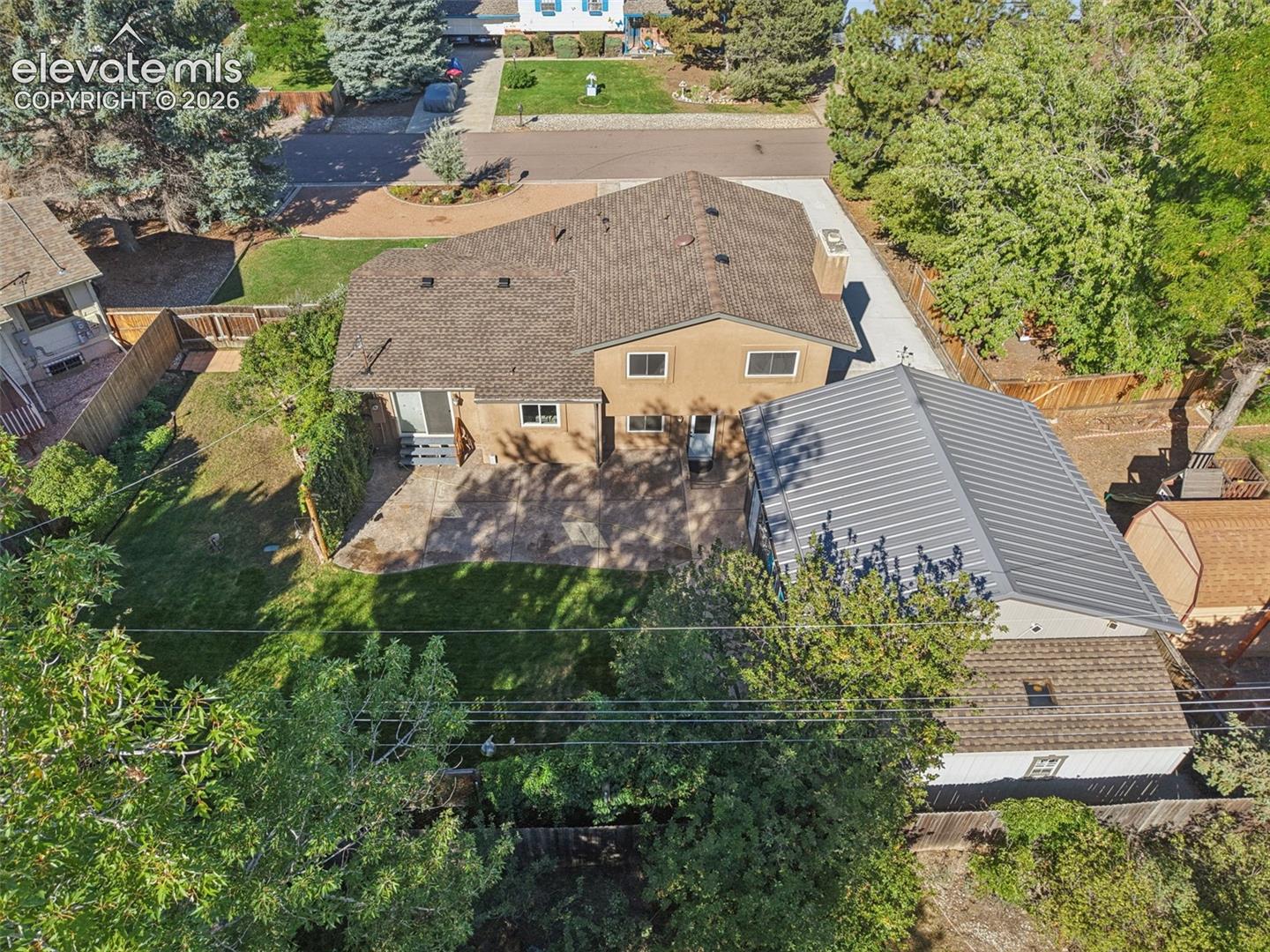 Aerial rear view to include large shed behind detached garage