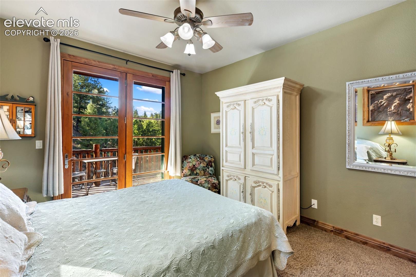 Main level bedroom w/ private deck