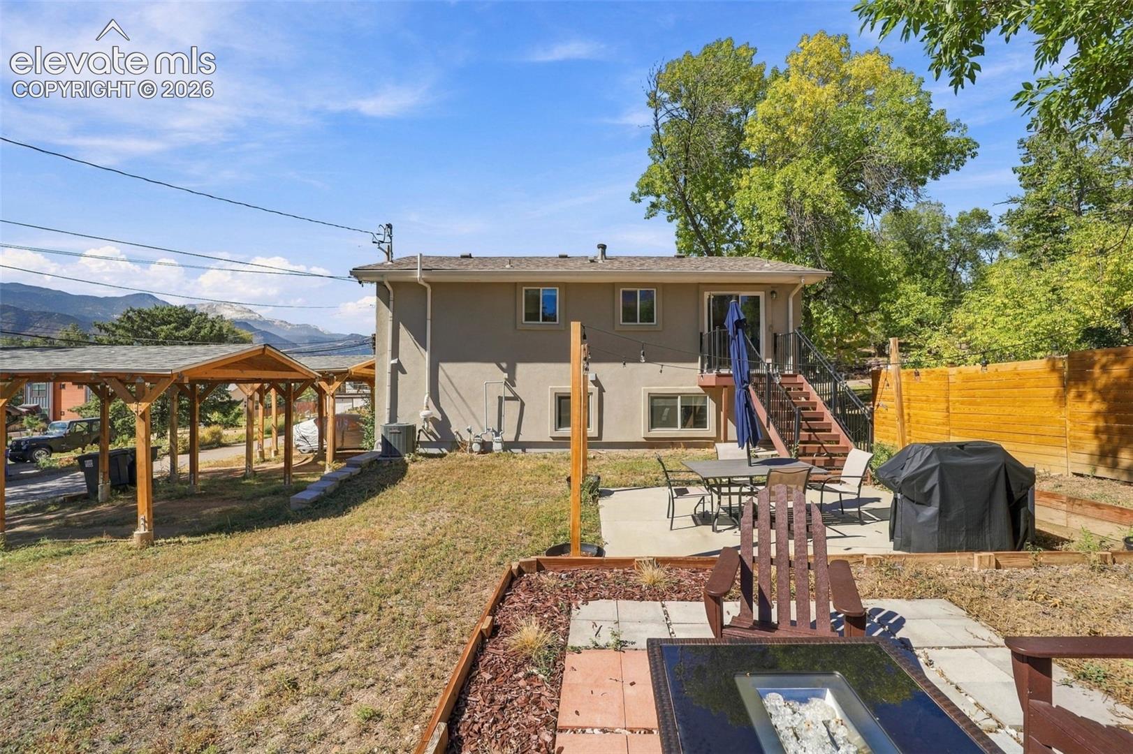 Enjoy the gas fire pit and views of Pikes Peak from the large back yard!