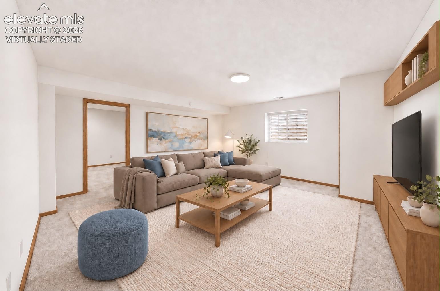 2nd Family room & 5th bedroom behind.  Perfect multi gen suite! Virtually staged.