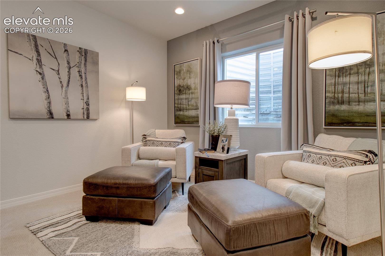 Neutral-toned interior space featuring recessed ceiling lighting, a sliding window with a window well, and plush carpeting