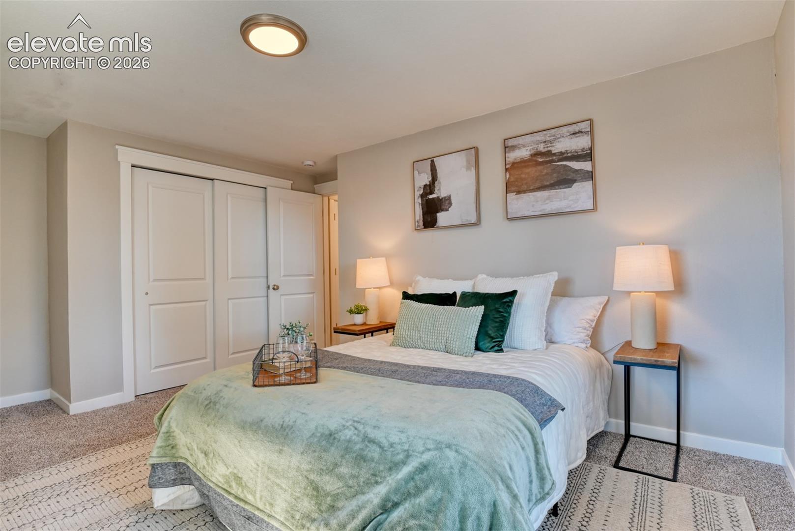 Recessed ceiling lighting, durable carpeting, sliding panel closet doors, and light-toned wall finishes