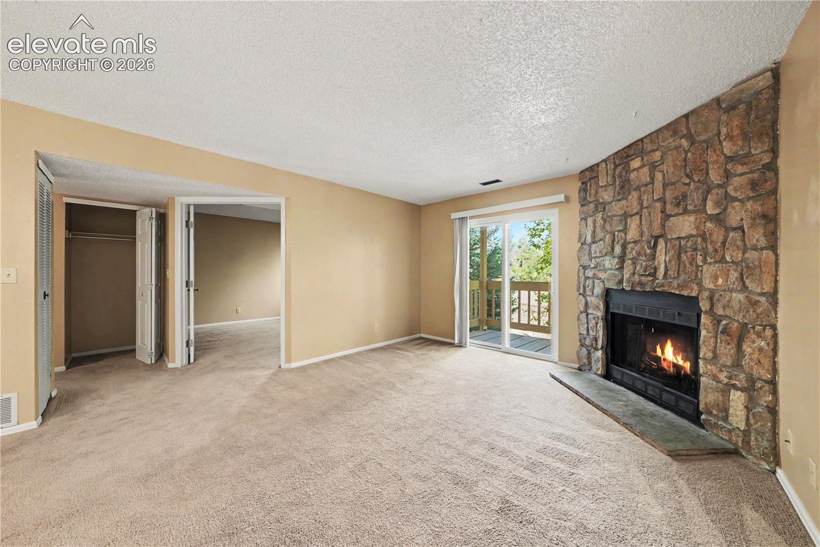 Carpeted living room with natural light