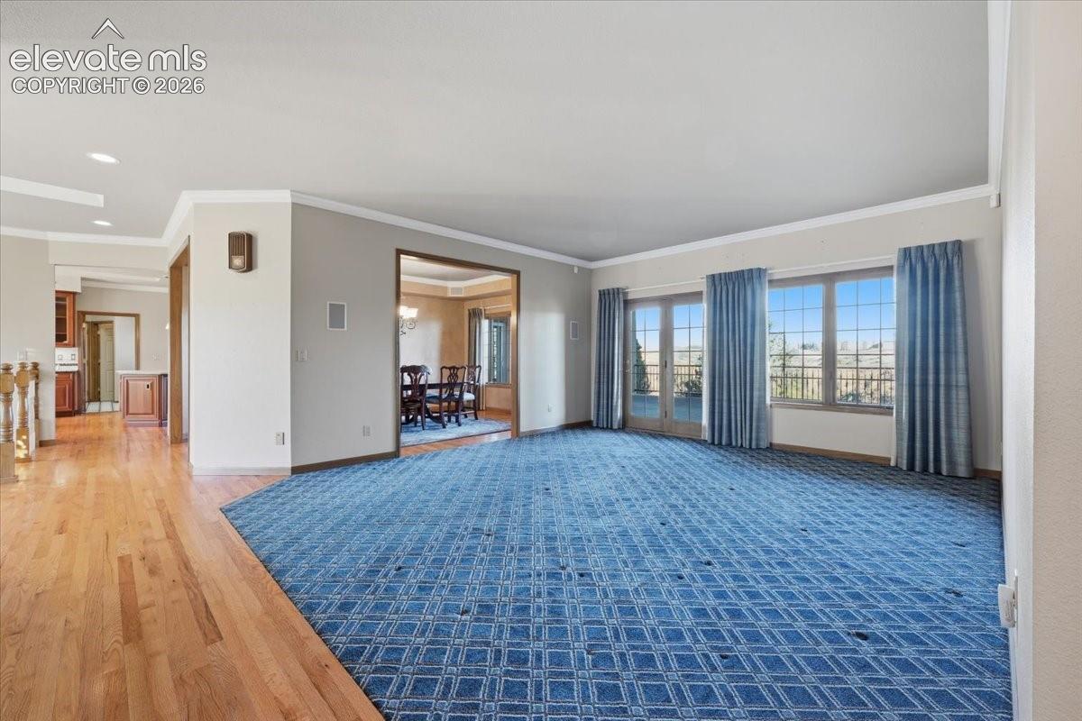 Formal living room with the first walk-out to the huge covered deck. 