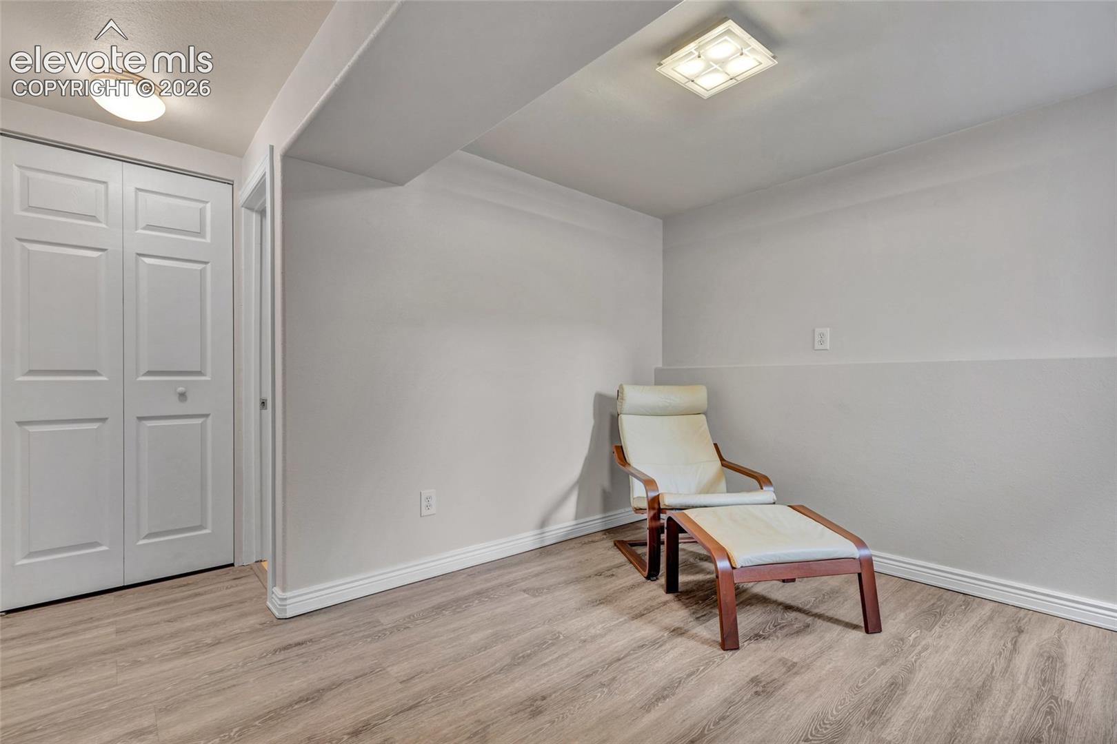 Room featuring light wood-finish flooring and white baseboards