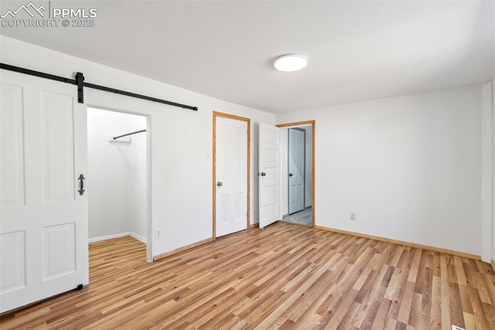 Barn door in Primary Bedroom and Direct Access to Full Bathroom
