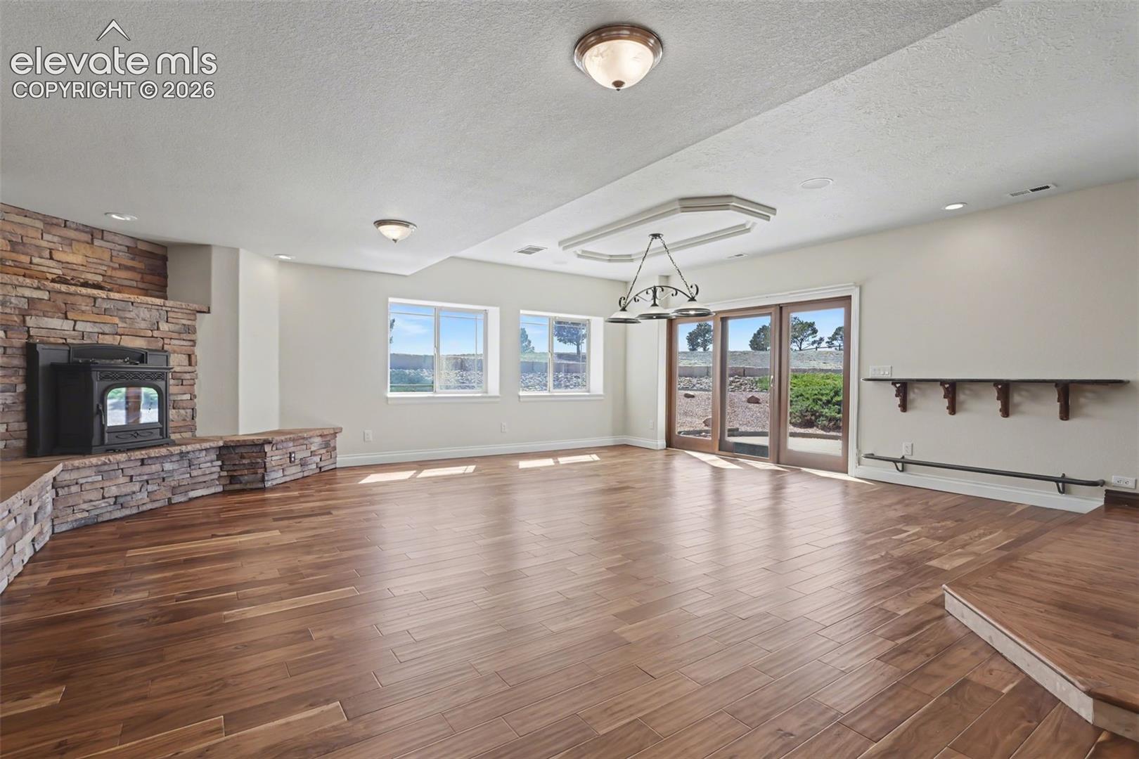 Basement Walk-Out Family Room w/Pellet Stove and Vintage Bar