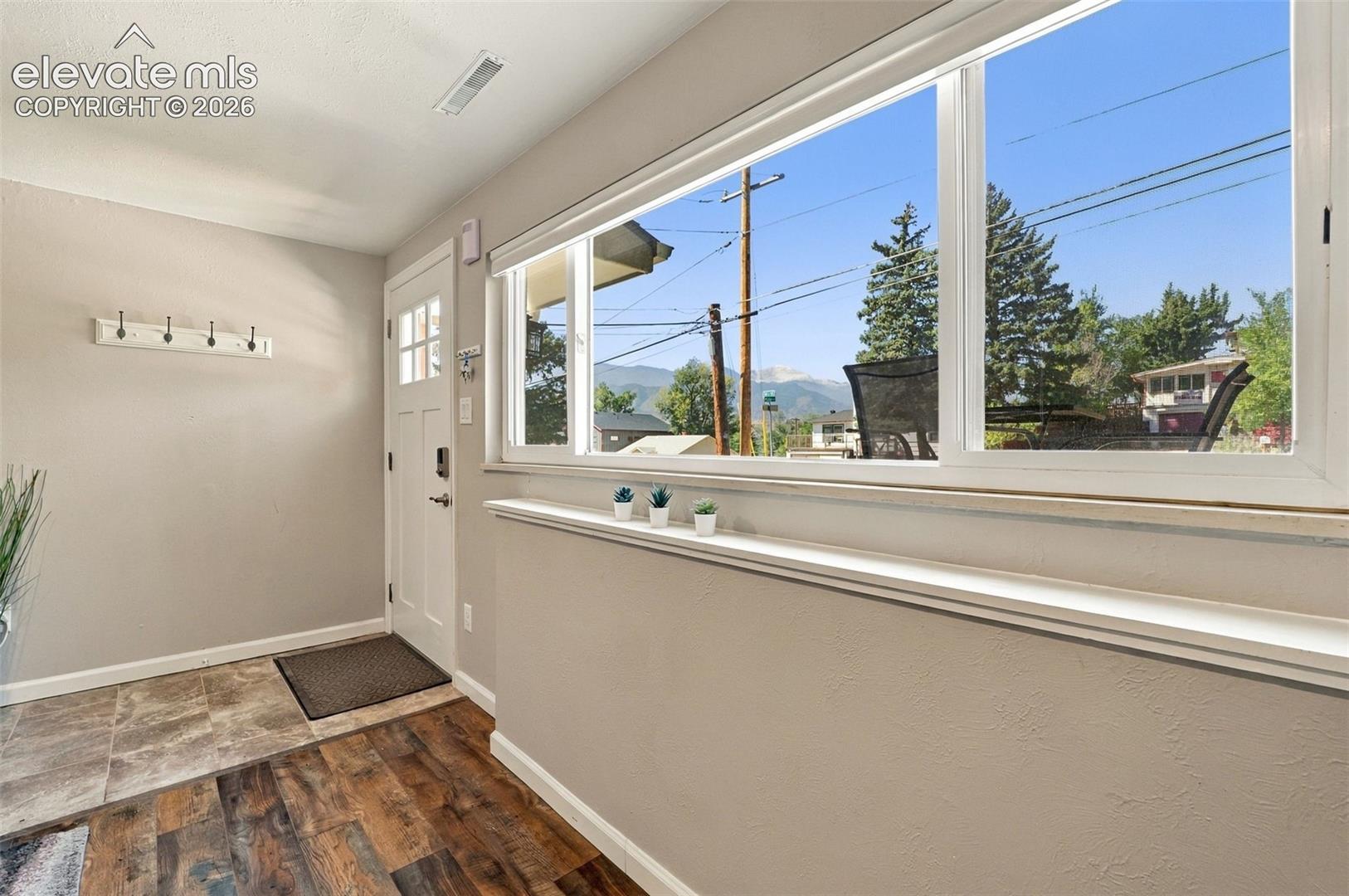 Entryway to lower level unit and window out the front