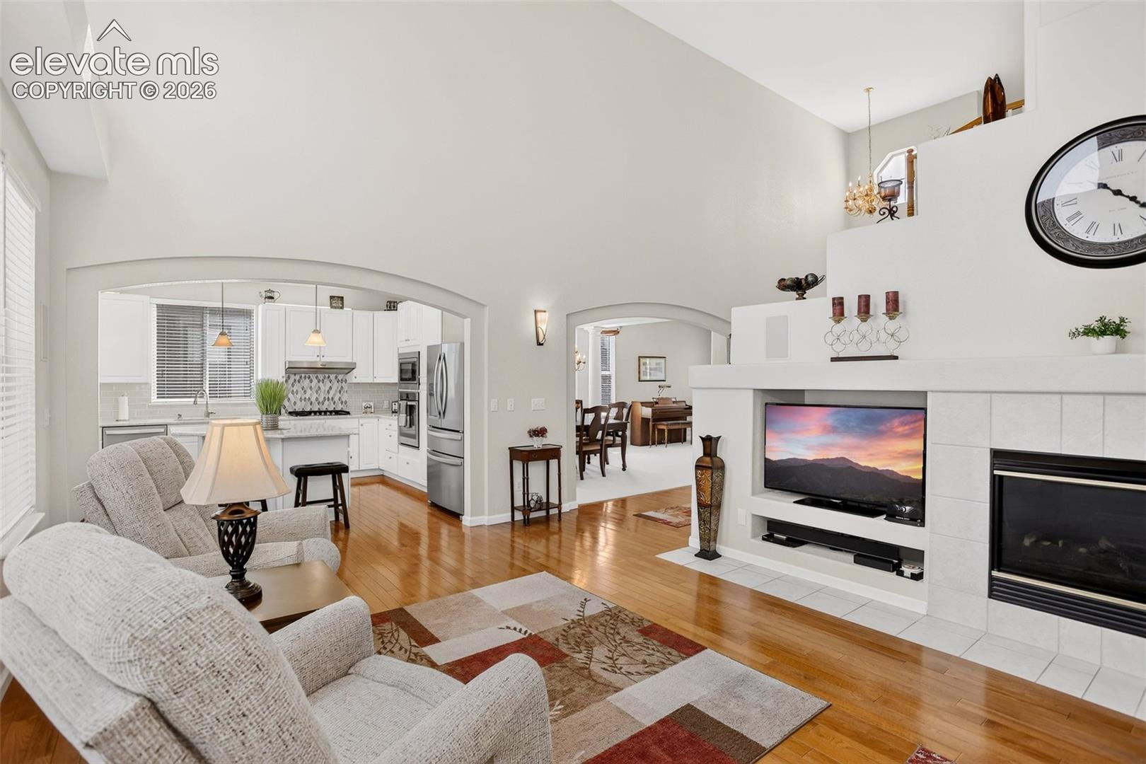 Vaulted ceilings with warm wood-finish flooring